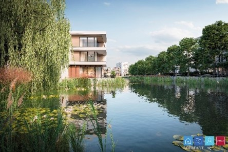 Blick auf die Seestadt Mönchengladbach mit Wohnhäusern am Ufer eines Sees.